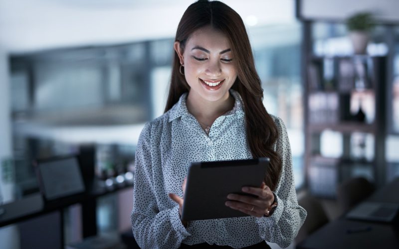 shot-of-a-young-businesswoman-using-a-digital-tablet-in-an-office-at-night.jpg